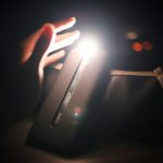 person holding black power bank