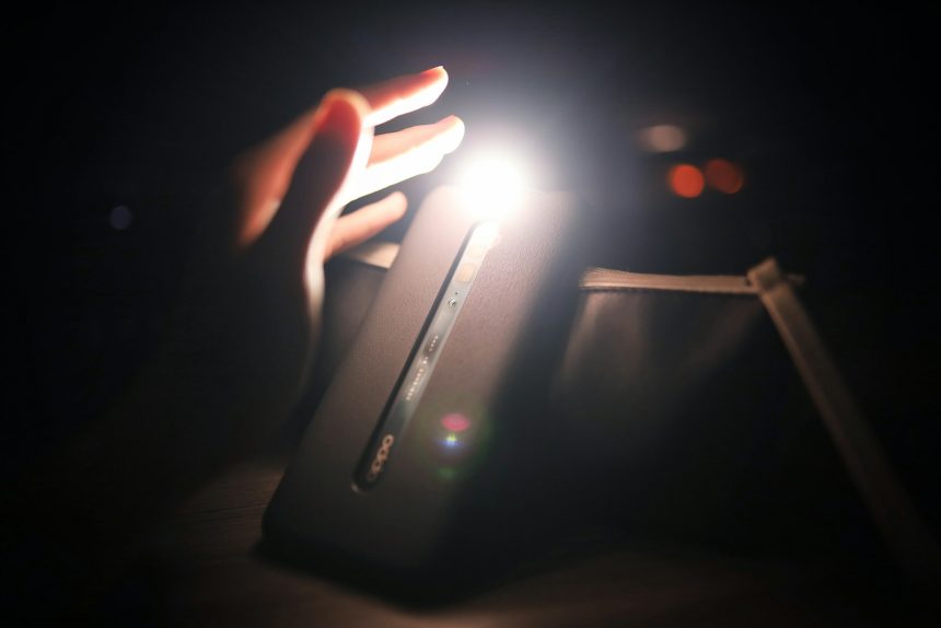 person holding black power bank