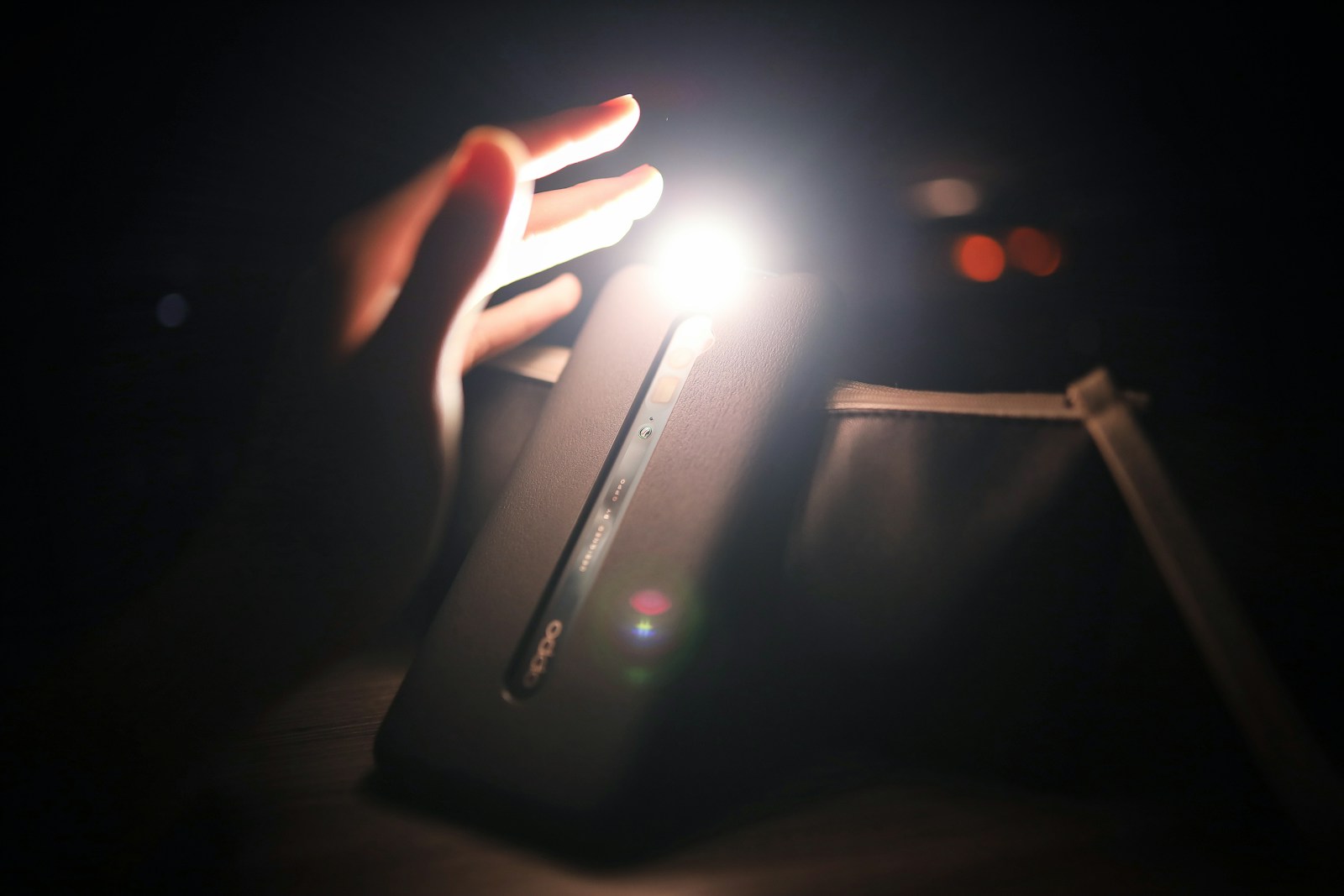 person holding black power bank