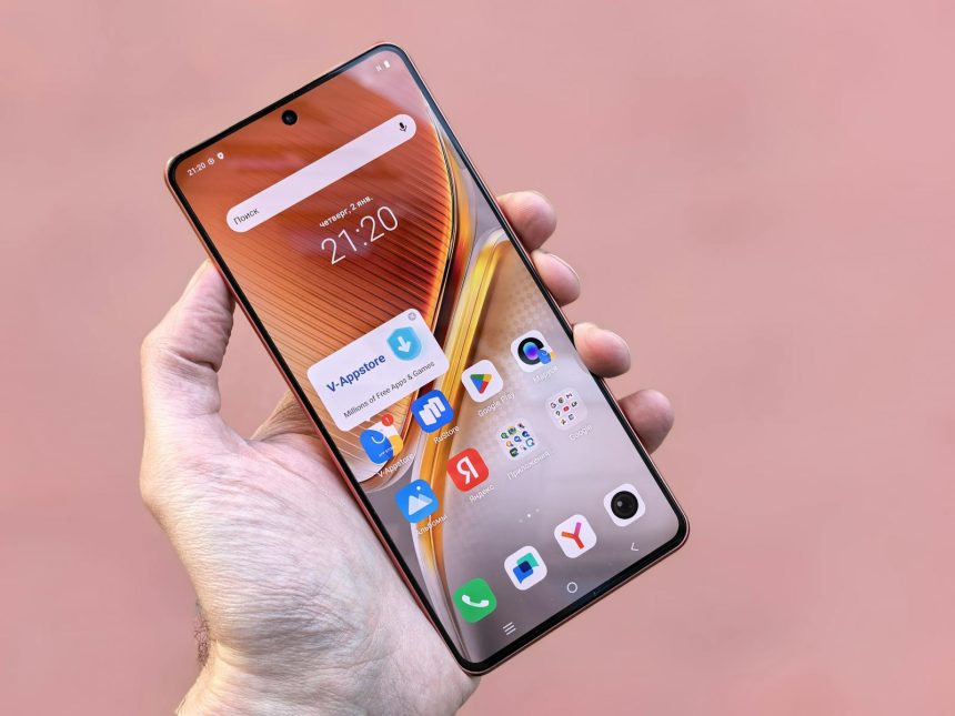 A person holding a smartphone displaying various apps on a pink background. Ideal for technology themes.