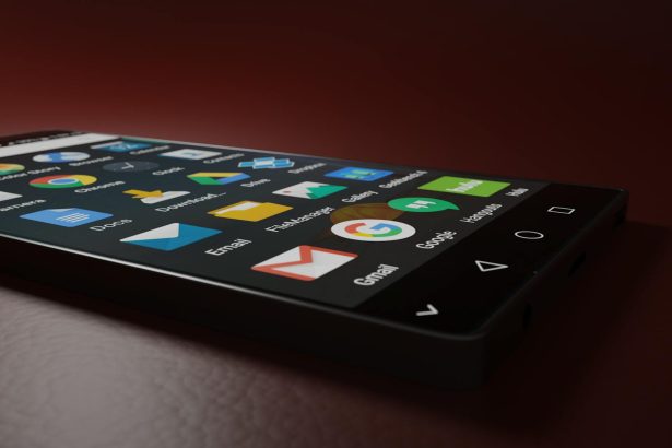 Close-up of a smartphone displaying various app icons in a low-light setting.
