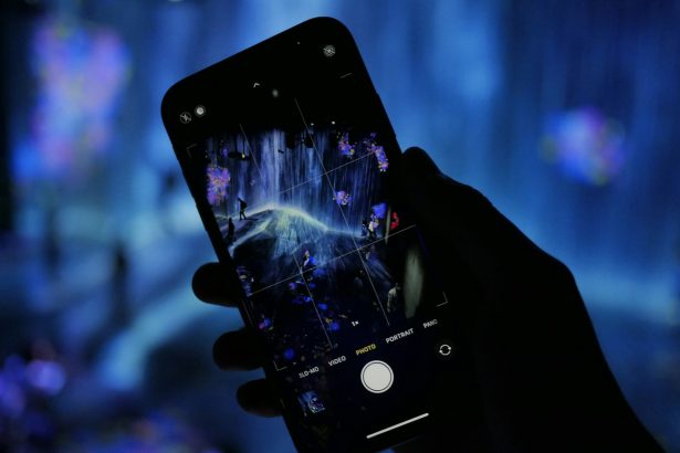 a person holding a cell phone in their hand