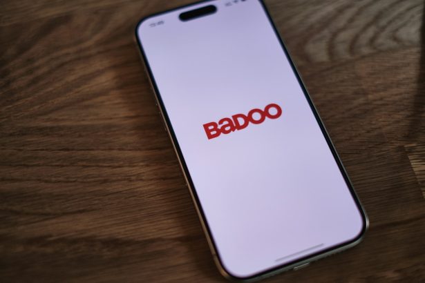 A badoo phone sitting on top of a wooden table
