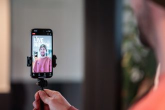 Man filming himself live on smartphone