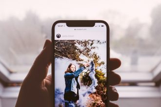 woman wearing blue denim jacket standing screengrab