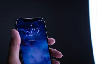 person holding space gray iPhone X