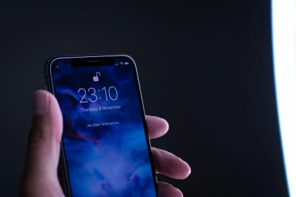 person holding space gray iPhone X