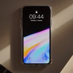 a cell phone sitting on top of a wall