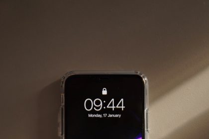 a cell phone sitting on top of a wall
