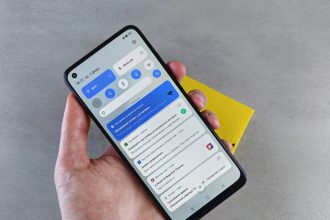 a person holding a cell phone in their hand